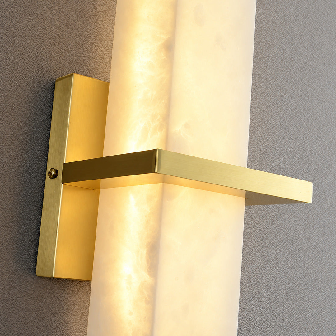 Close-up of natural veining glowing through the alabaster cylinder of the Colonna sconce
