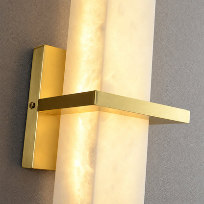 Close-up of natural veining glowing through the alabaster cylinder of the Colonna sconce