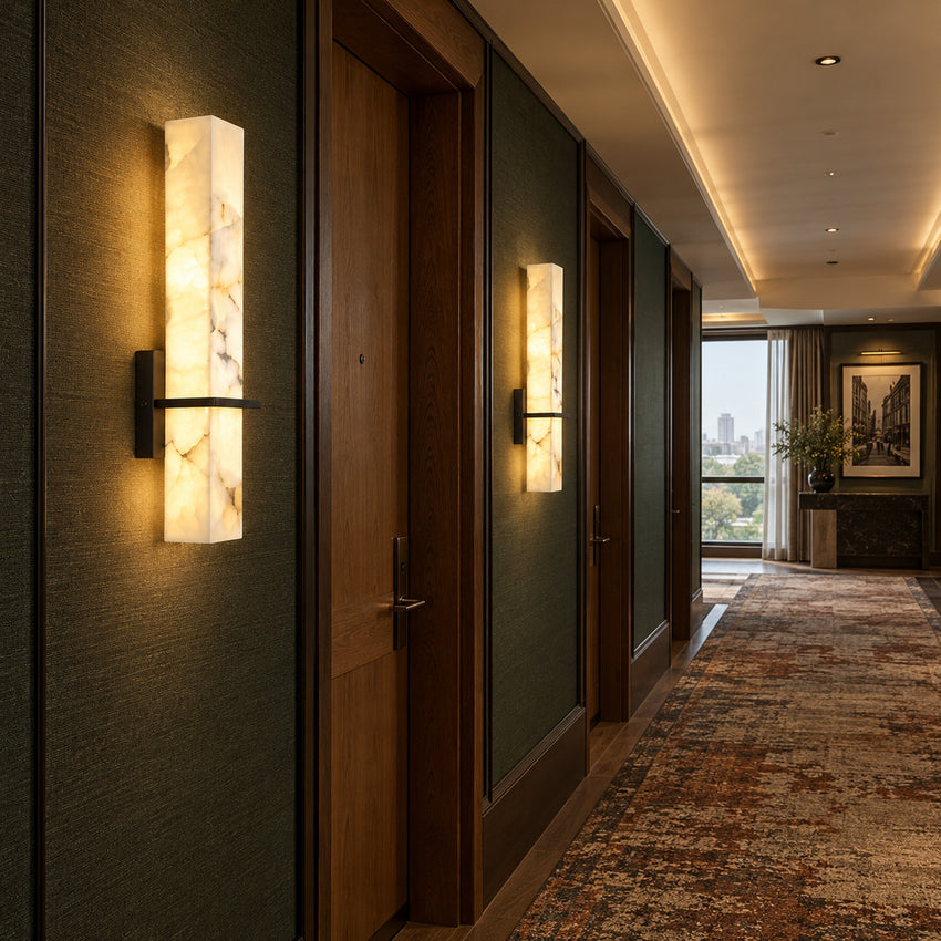 Row of Colonna alabaster wall sconces lighting a long hallway