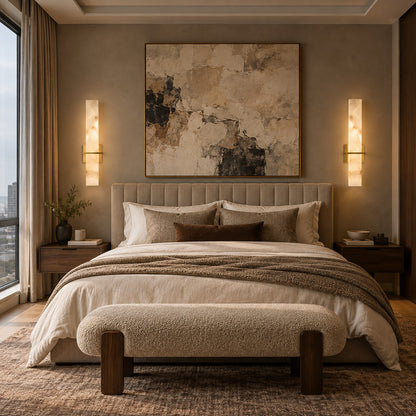 Pair of Colonna alabaster sconces on either side of a bed headboard