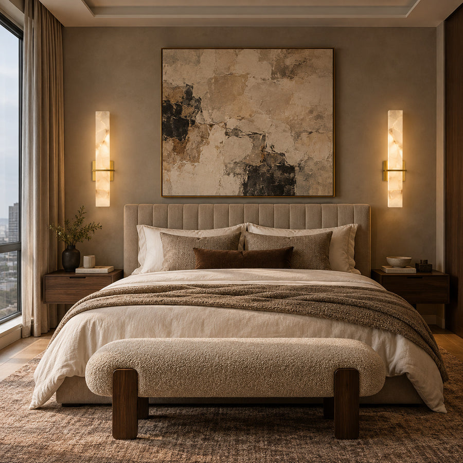 Pair of Colonna alabaster sconces on either side of a bed headboard
