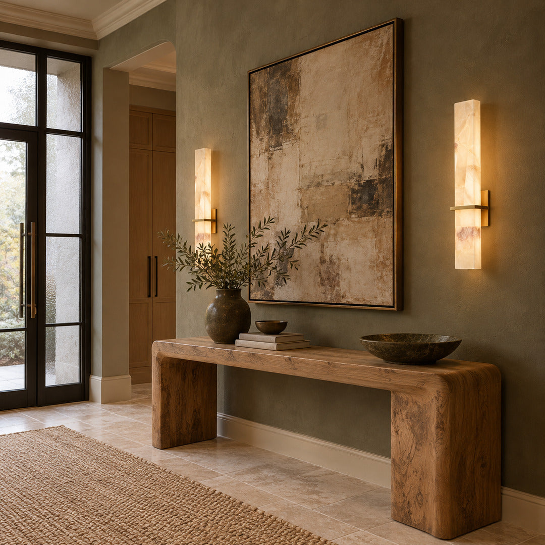 Colonna alabaster wall sconce warming an entryway