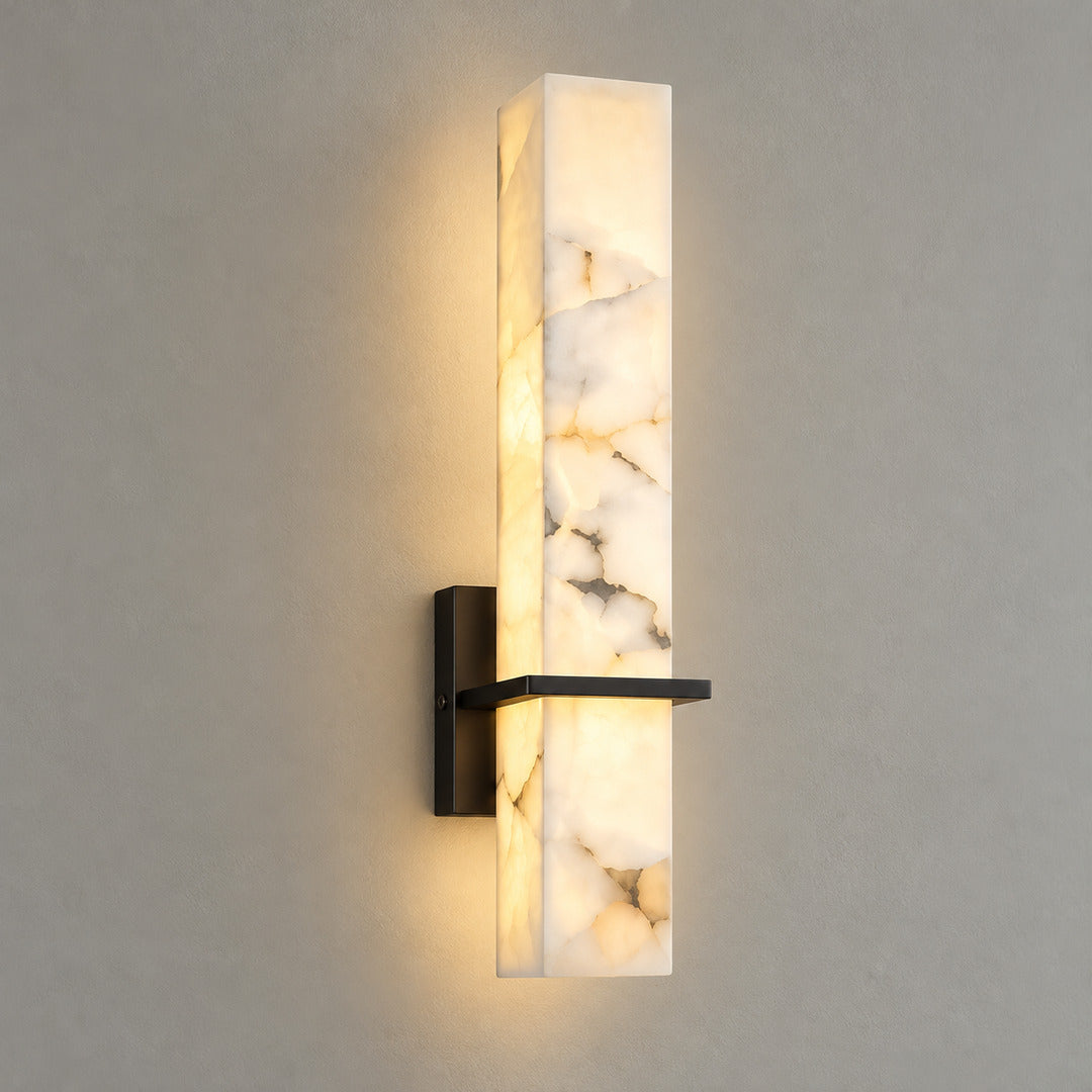 Colonna alabaster wall sconce in black and white alabaster with warm white light