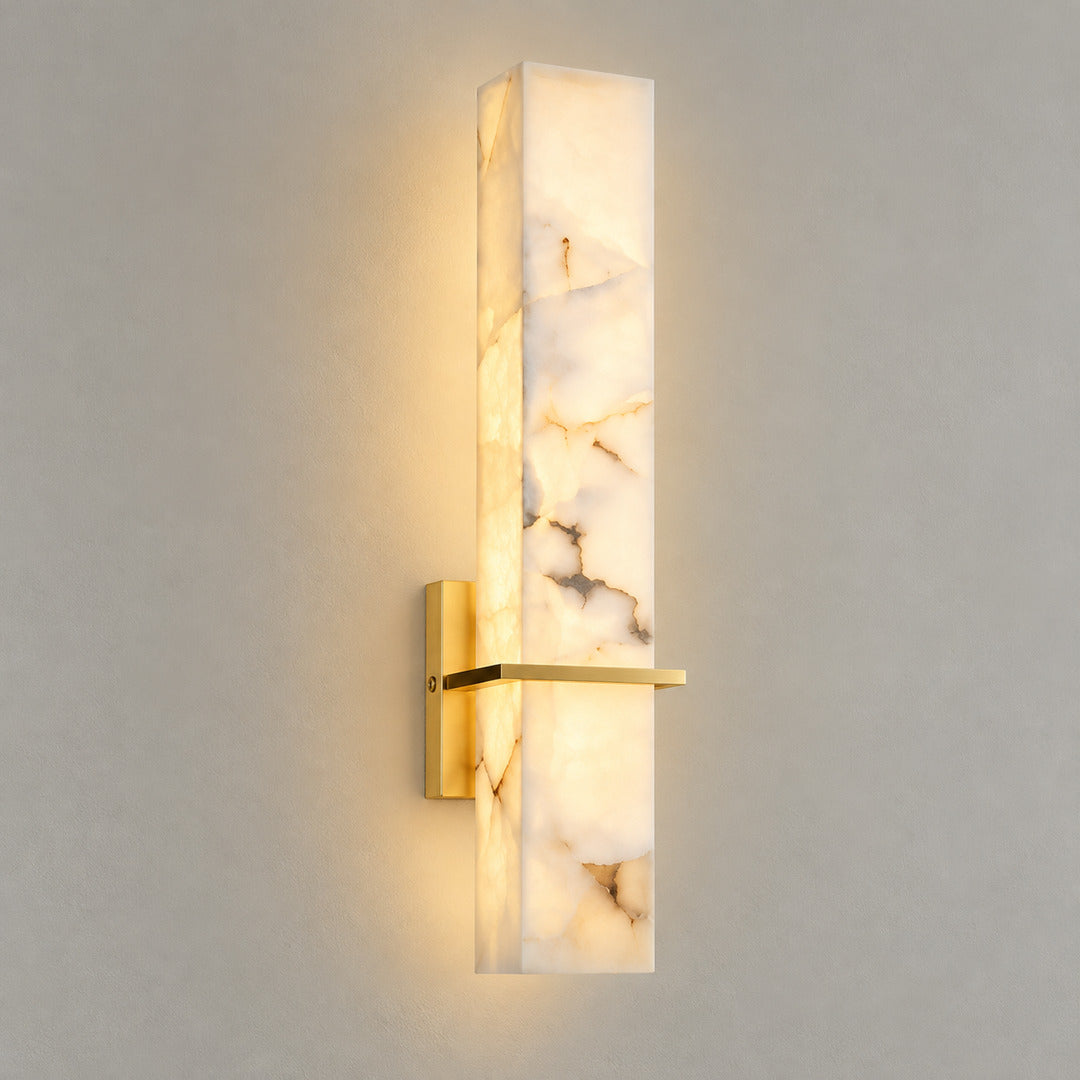 Colonna alabaster wall sconce in brass and white alabaster with warm white light