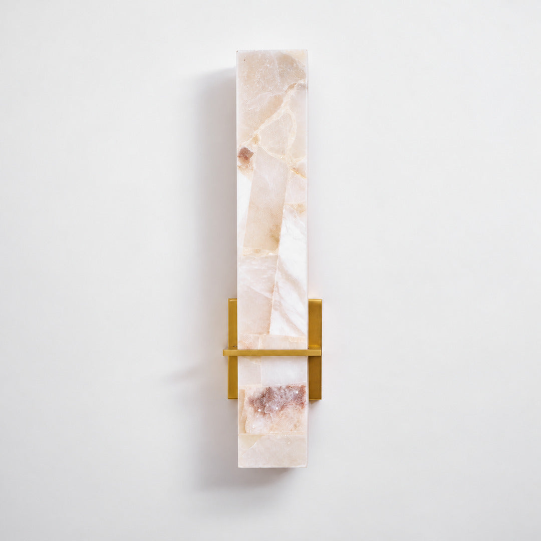 Close-up of natural veining glowing through the alabaster cylinder of the Colonna sconce