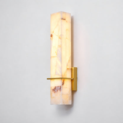 Colonna alabaster cylinder wall sconce shown lit and unlit side by side