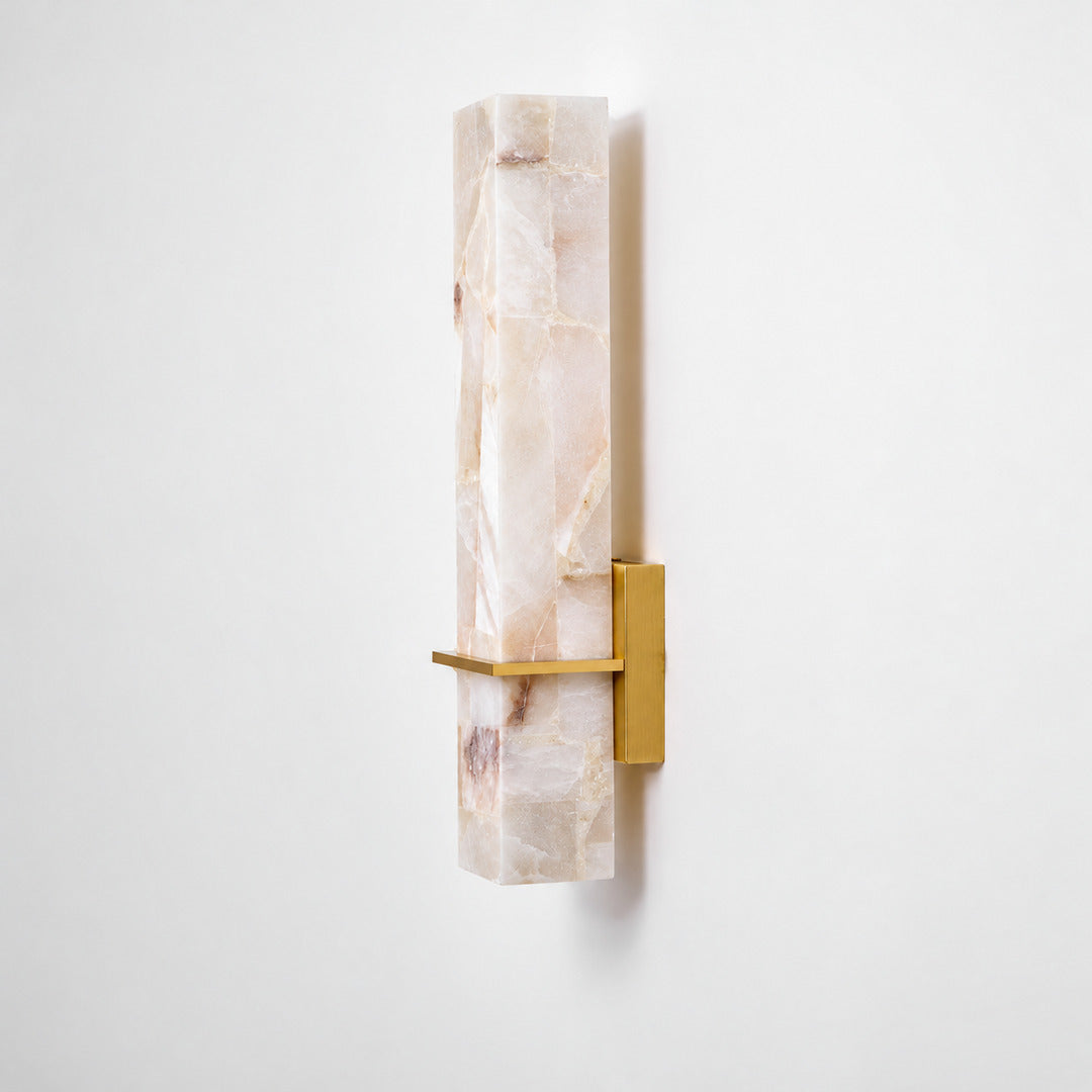 Colonna alabaster cylinder wall sconce shown lit and unlit side by side