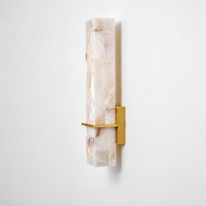 Colonna alabaster cylinder wall sconce shown lit and unlit side by side