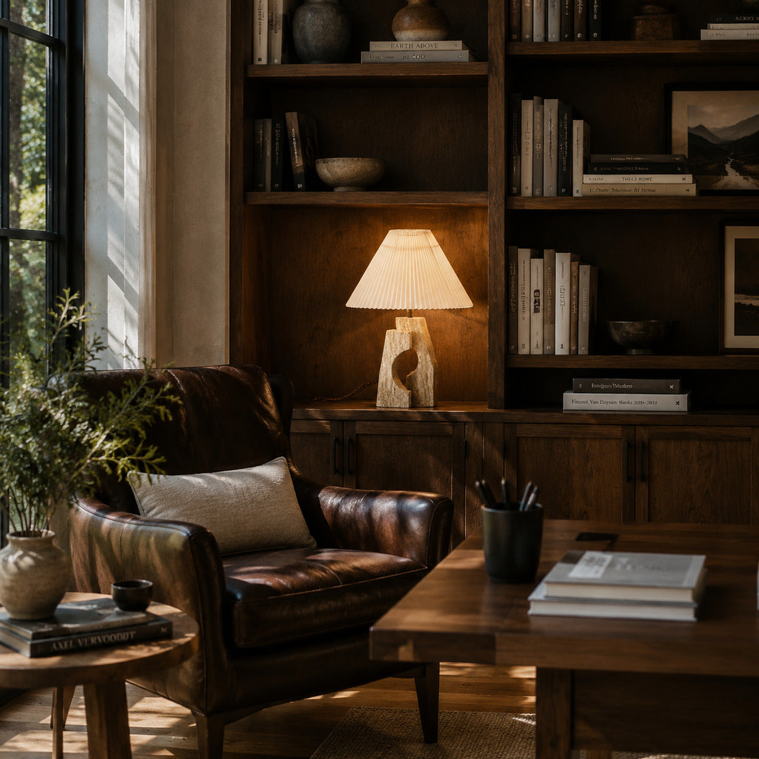 Colonna travertine table lamp illuminated evening warm glowing natural travertine stone fabric elegant cozy American home lifestyle interior