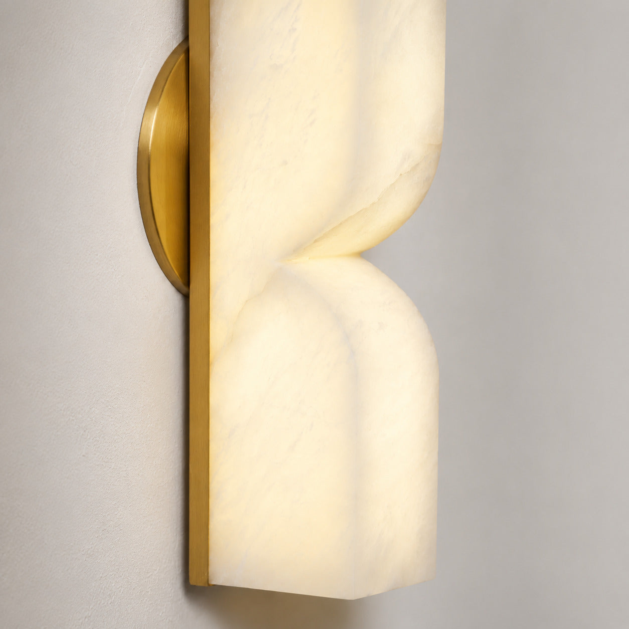 Contatto alabaster wall sconce solid carved stone block sculptural form profile side view natural organic depth