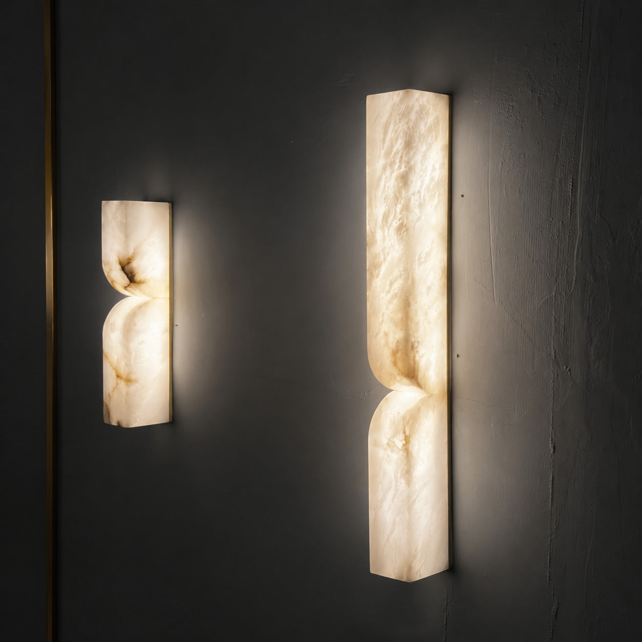 Contatto alabaster wall sconce staircase stairwell wall tall carved natural stone warm glow American home lifestyle interior