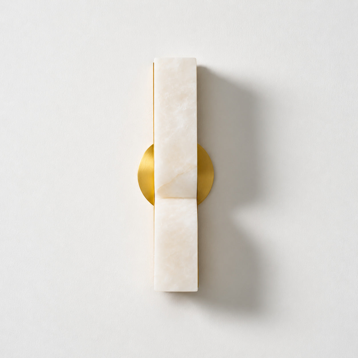 Contatto alabaster wall sconce carved internal curves natural stone organic veining unique pattern detail close up craftsmanship