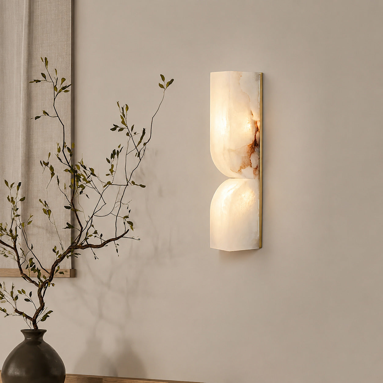 Contatto alabaster wall sconce living room wall carved natural stone statement quiet luxury American home lifestyle interior styled