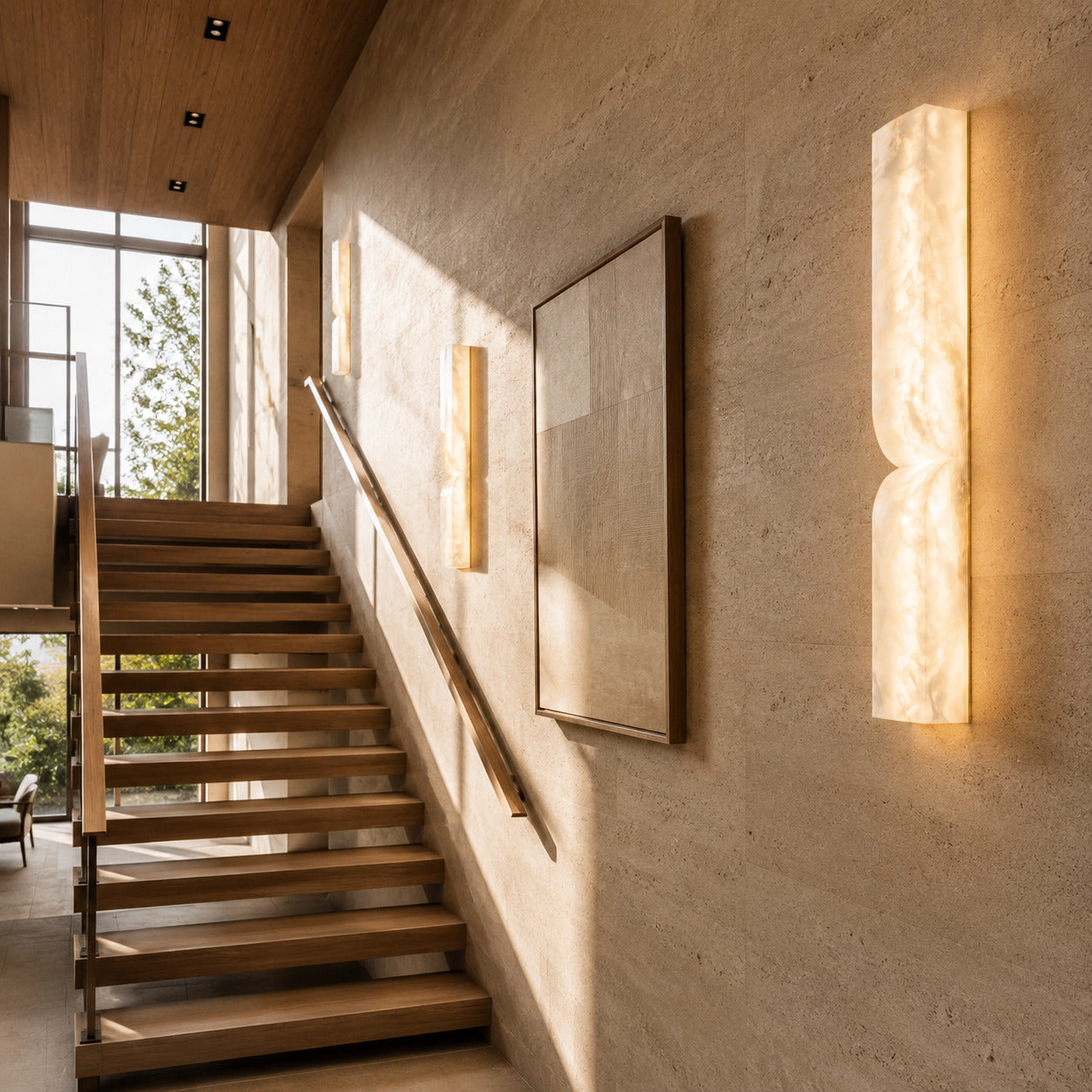 Contatto alabaster wall sconce staircase stairwell wall tall carved natural stone warm glow American home lifestyle interior