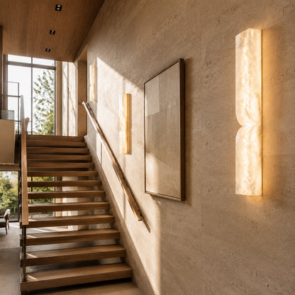 Contatto alabaster wall sconce staircase stairwell wall tall carved natural stone warm glow American home lifestyle interior