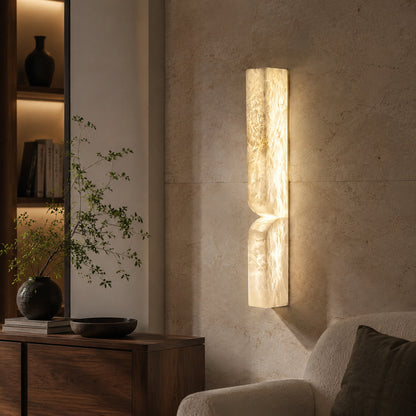 Contatto alabaster wall sconce illuminated evening wall carved natural stone warm glowing cozy American home lifestyle interior
