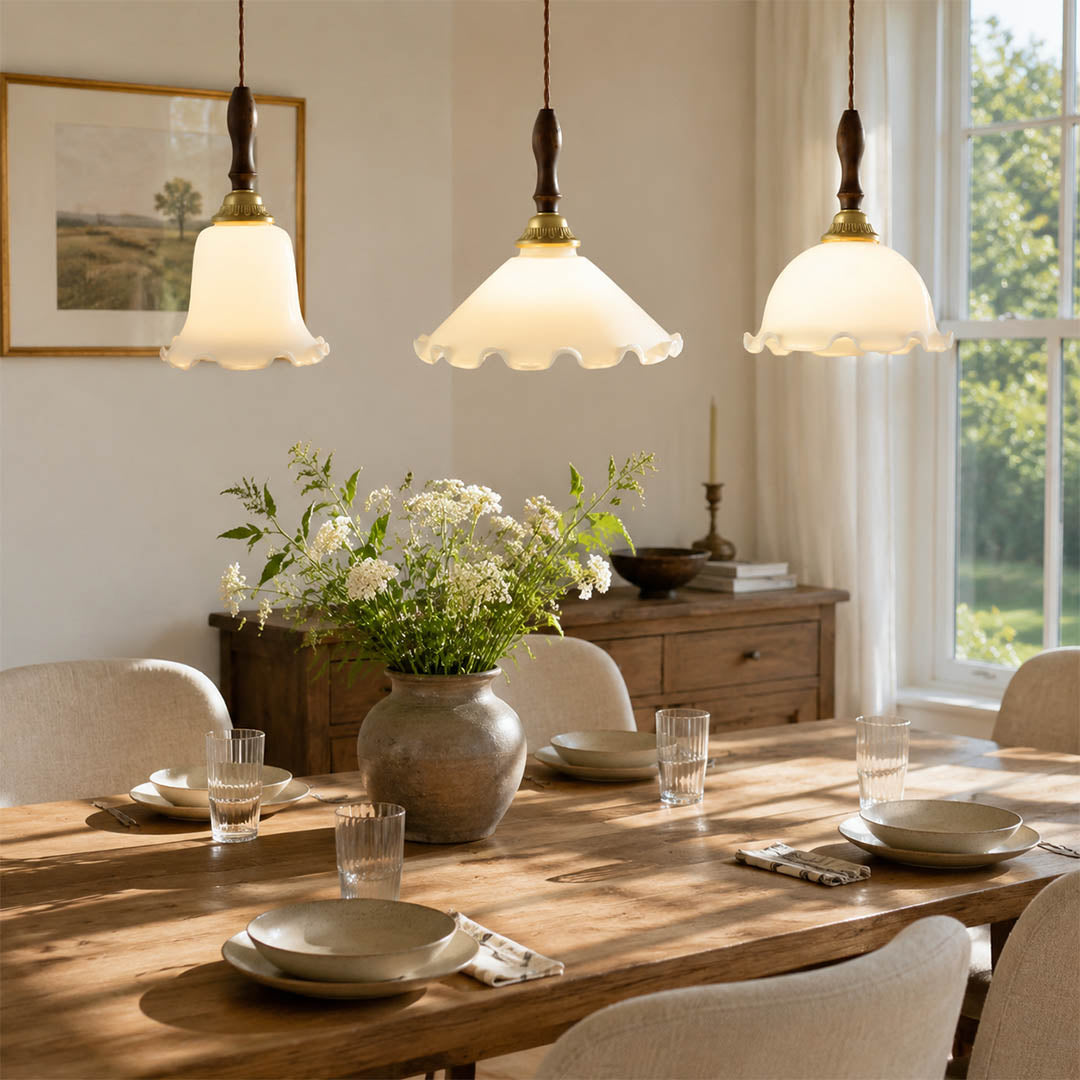 Cora Mini pendant cluster above long rectangular dining table modern open plan dining warm milky brass wood interior