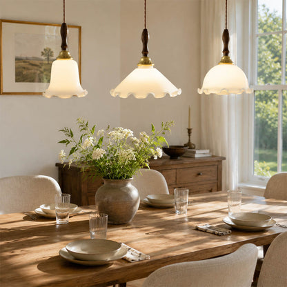 Cora Mini pendant cluster above long rectangular dining table modern open plan dining warm milky brass wood interior