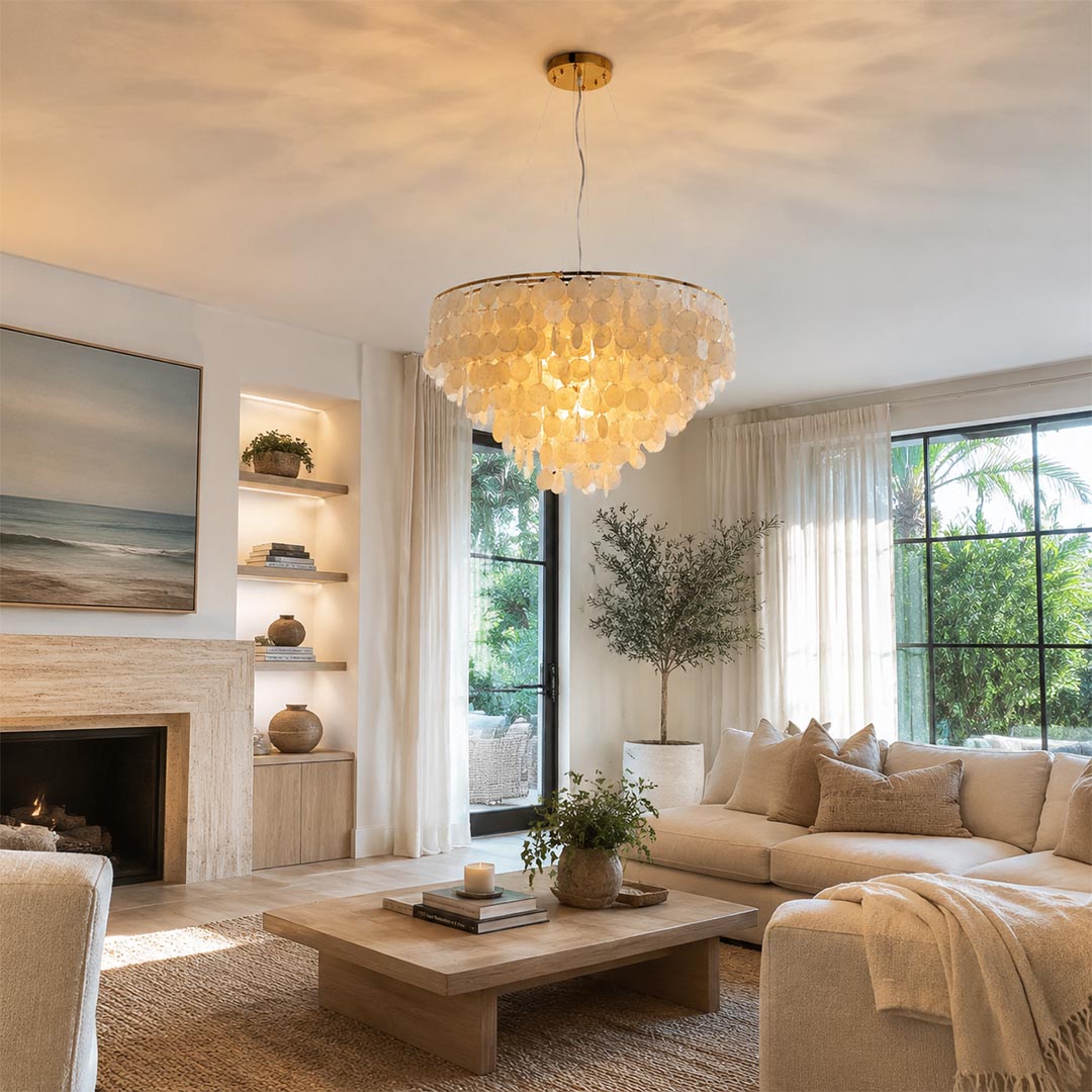 French country style living room centered with a warm glowing Coraline capiz shell wind chime chandelier