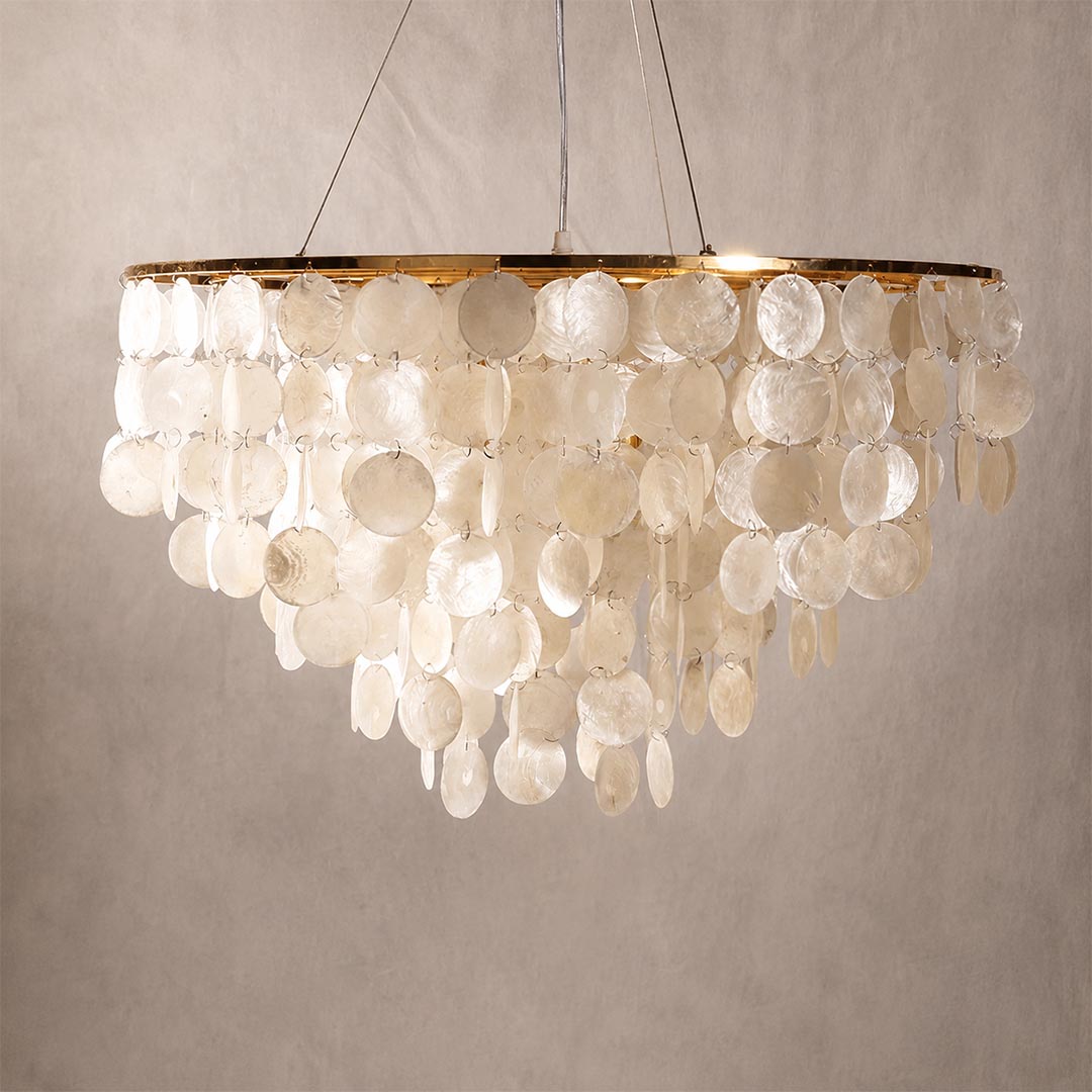 Unlit product view of the Coraline capiz shell wind chime chandelier showing natural mother of pearl discs