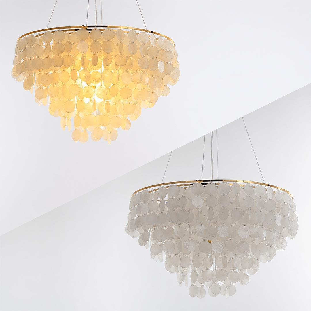 Multiple angles and sizes of the Coraline capiz shell wind chime chandelier against a white wall
