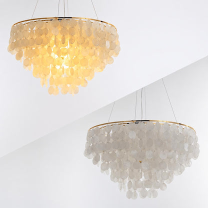 Multiple angles and sizes of the Coraline capiz shell wind chime chandelier against a white wall