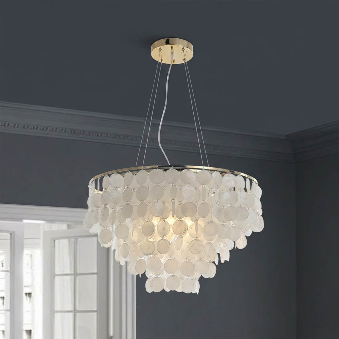 Coraline Capiz shell wind chime chandelier Boho Bohemian living room natural rattan plants warm glow Coastal Cottagecore lifestyle
