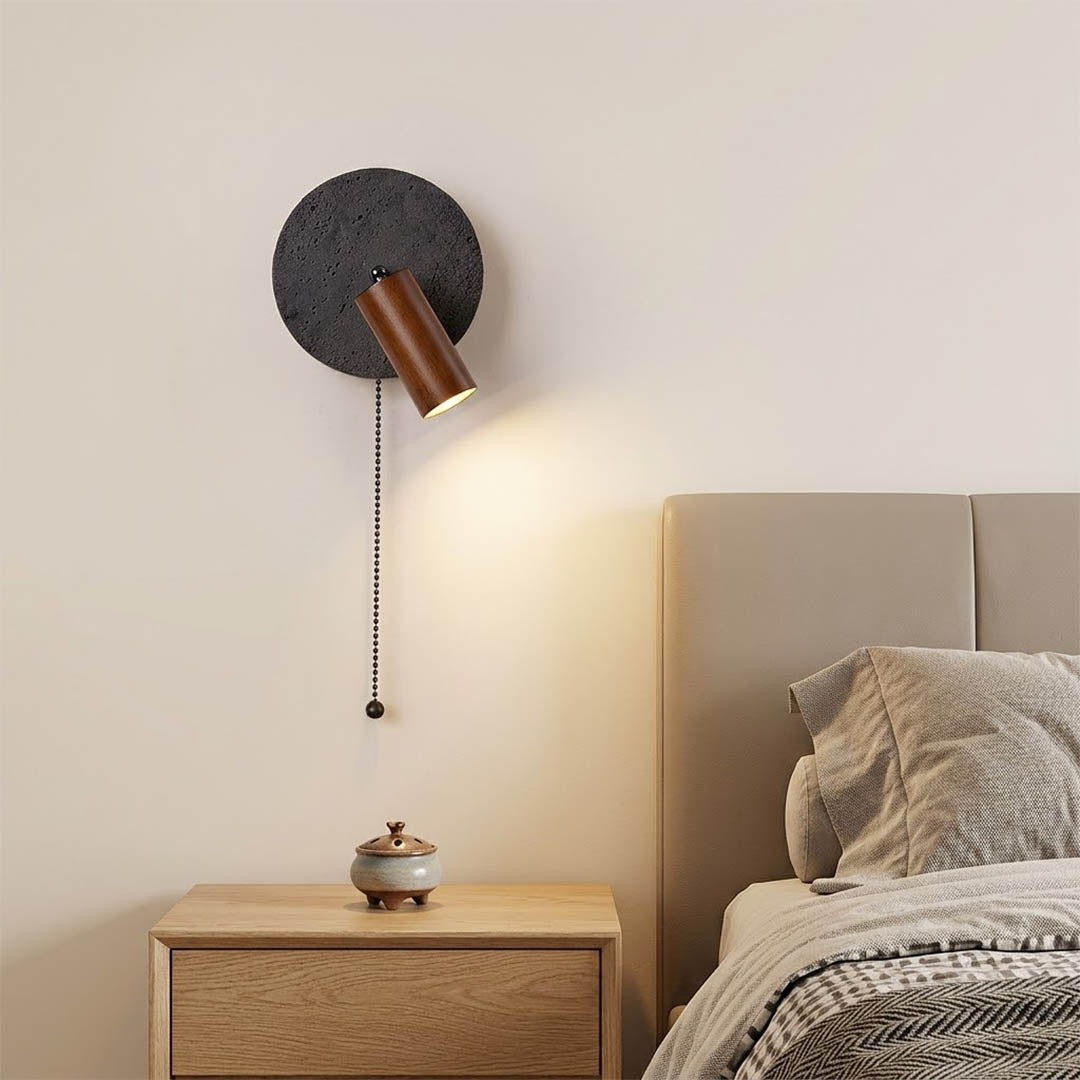 Cove travertine wall sconce mounted beside bed bedroom warm light walnut wood interior