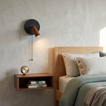 Cove travertine wall sconce mounted beside bed bedroom warm light walnut wood interior