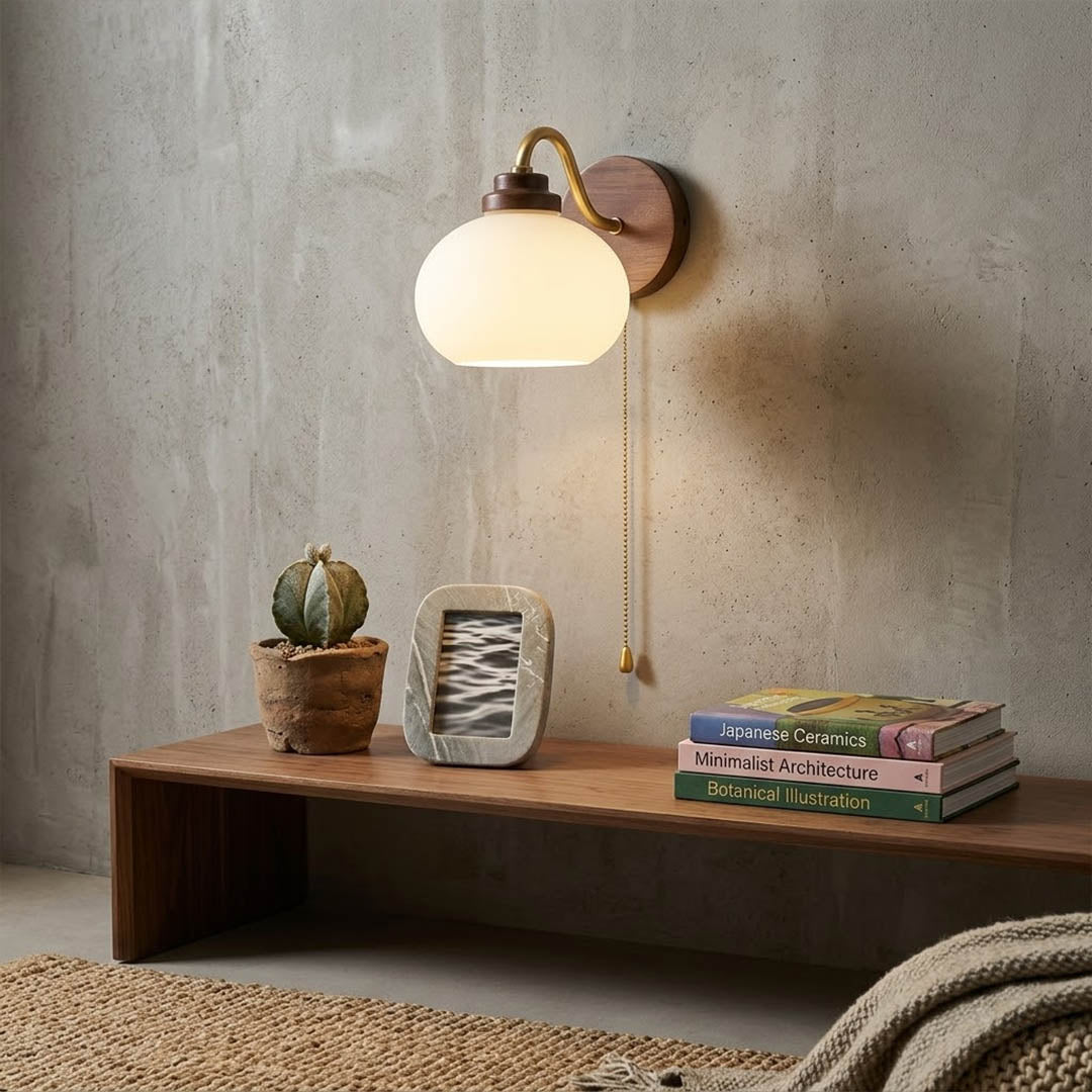 Crescent wall lamp pair beside bed bedroom warm frosted glass glow wood interior