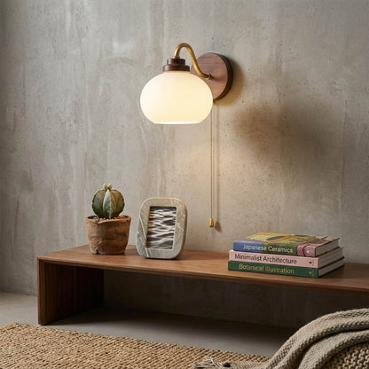 Crescent wall lamp pair beside bed bedroom warm frosted glass glow wood interior