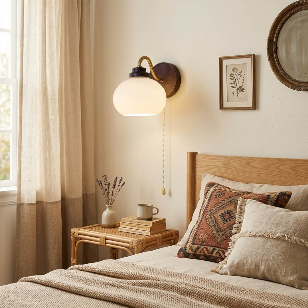 Crescent wall lamp pair beside bed bedroom warm frosted glass glow wood interior