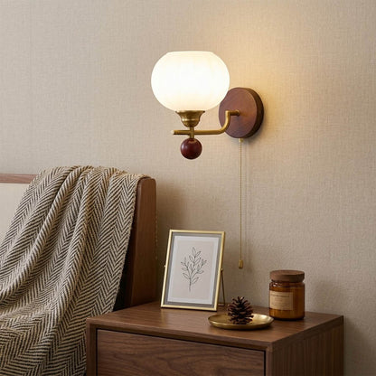 Crescent wall lamp pair beside bed bedroom warm frosted glass glow wood interior