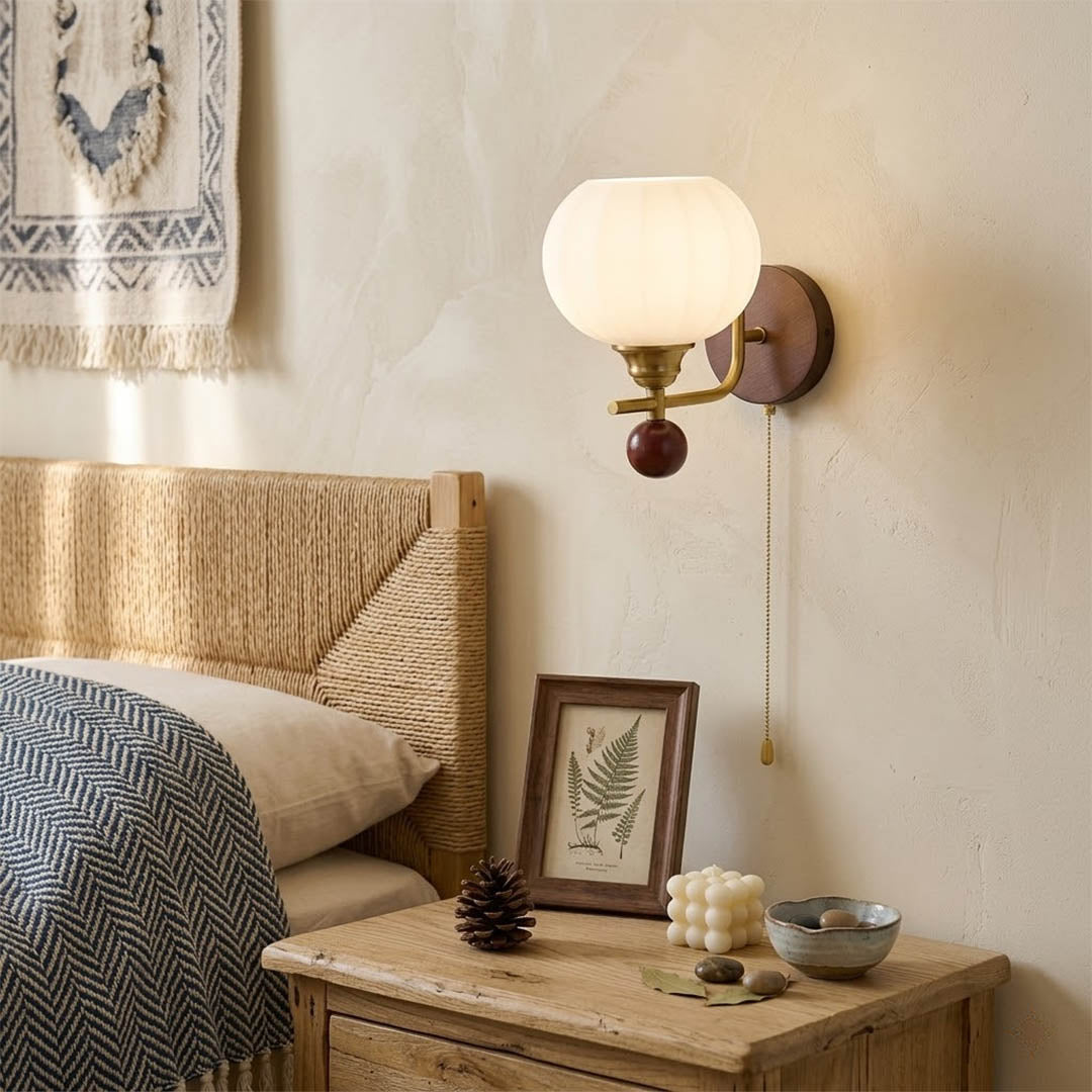 Crescent wall lamp pair beside bed bedroom warm frosted glass glow wood interior