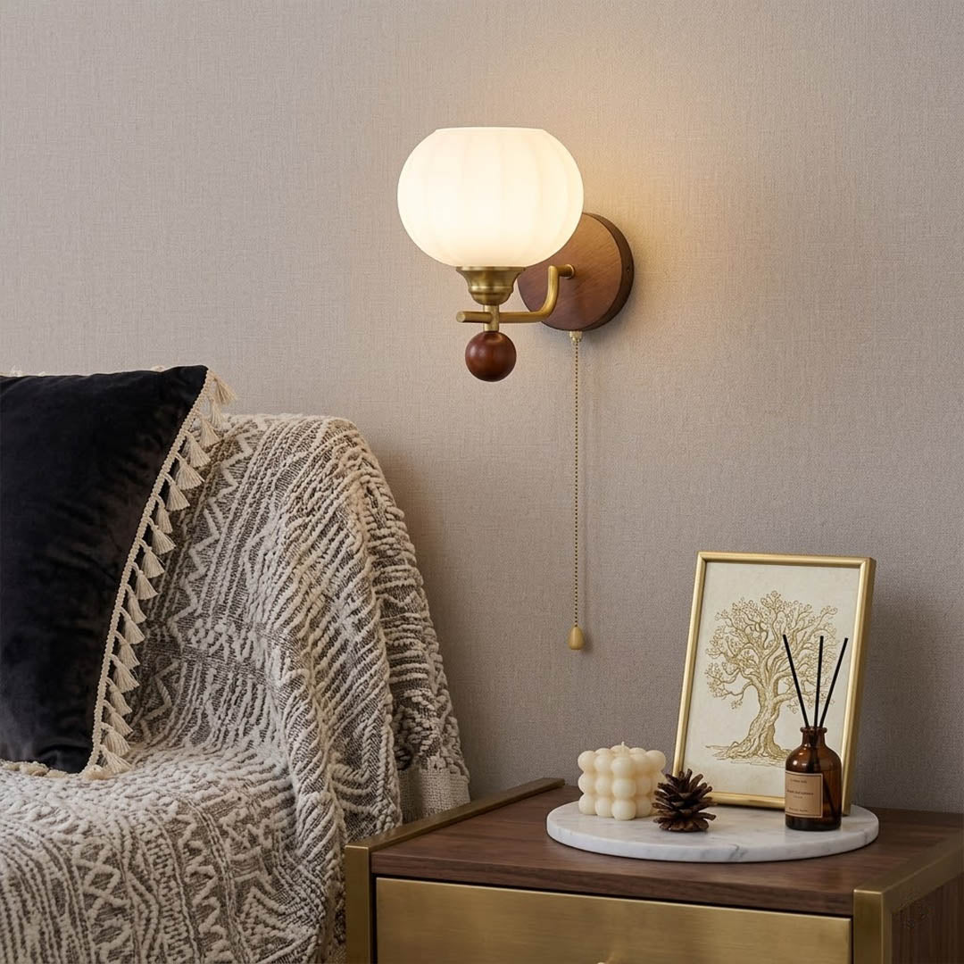 Crescent wall lamp pair beside bed bedroom warm frosted glass glow wood interior