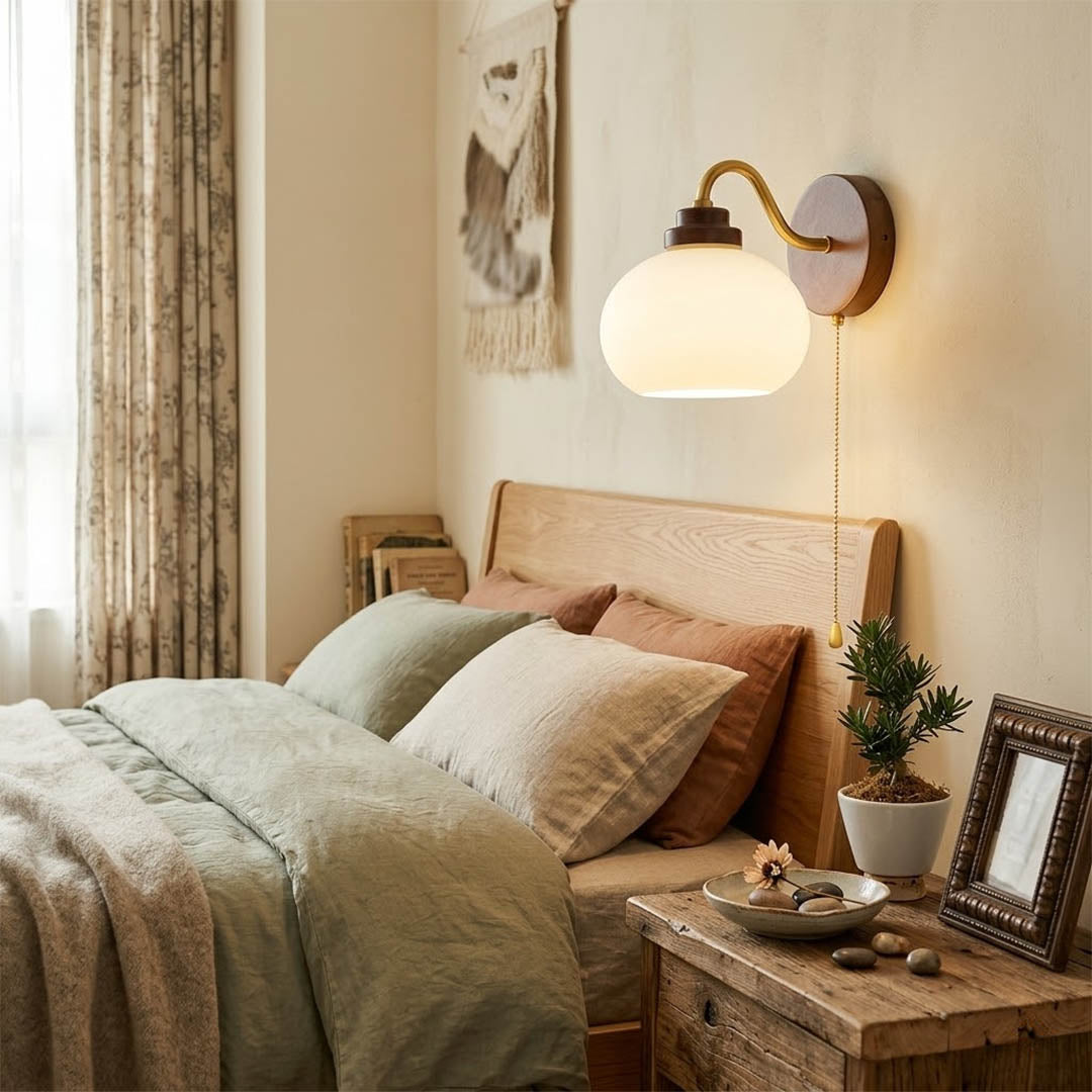 Crescent wall lamp pair beside bed bedroom warm frosted glass glow wood interior