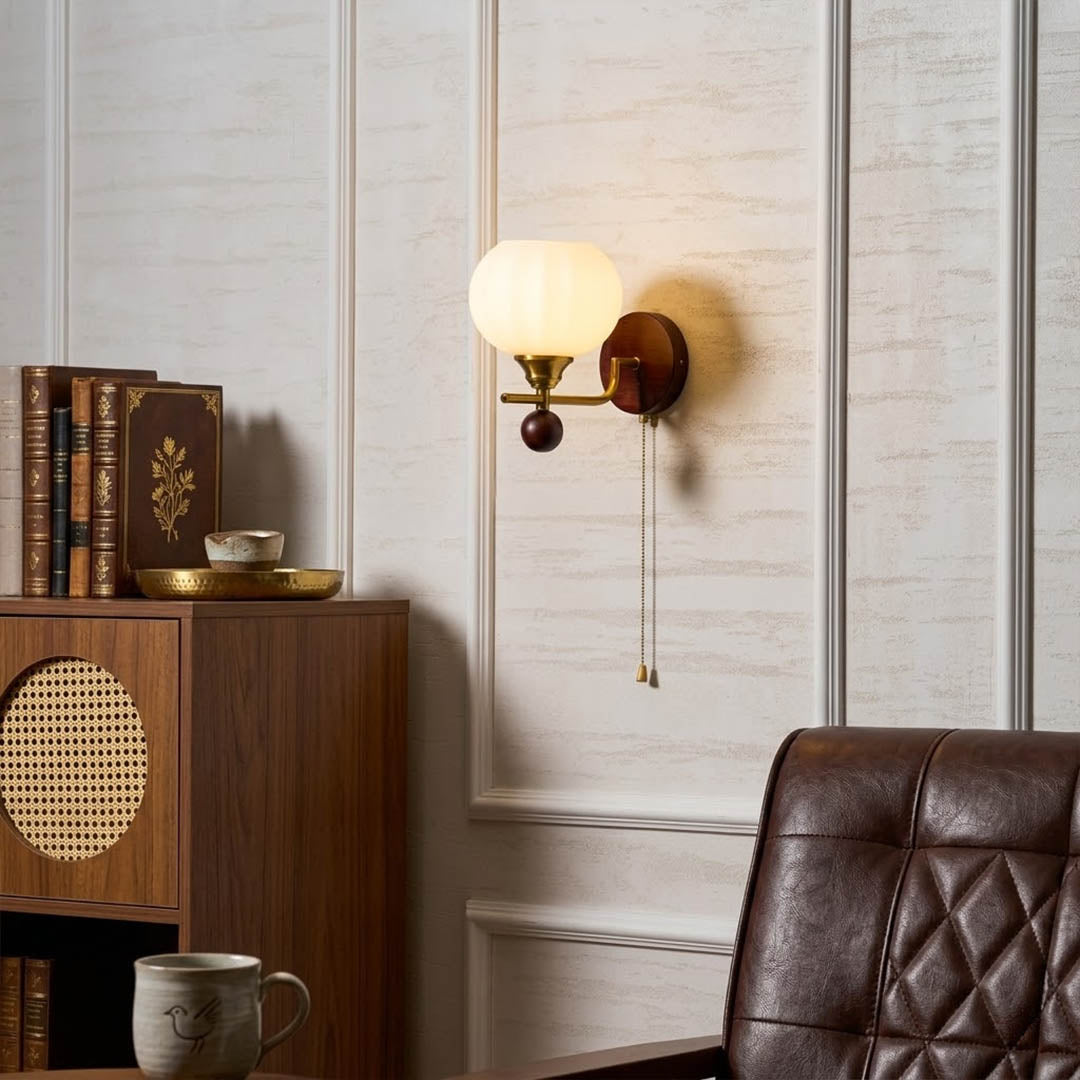Crescent wall lamp pair beside bed bedroom warm frosted glass glow wood interior