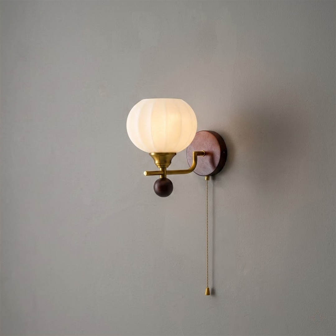 Crescent wall lamp pair beside bed bedroom warm frosted glass glow wood interior
