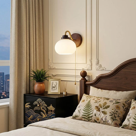 Crescent wall lamp pair beside bed bedroom warm frosted glass glow wood interior