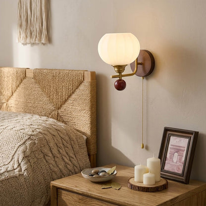 Crescent wall lamp pair beside bed bedroom warm frosted glass glow wood interior