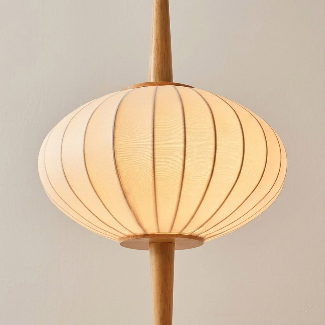 Cygnus hand stretched silk shade illuminated warm amber glow translucent ivory detail diffuse lighting natural material