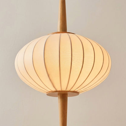 Cygnus hand stretched silk shade illuminated warm amber glow translucent ivory detail diffuse lighting natural material