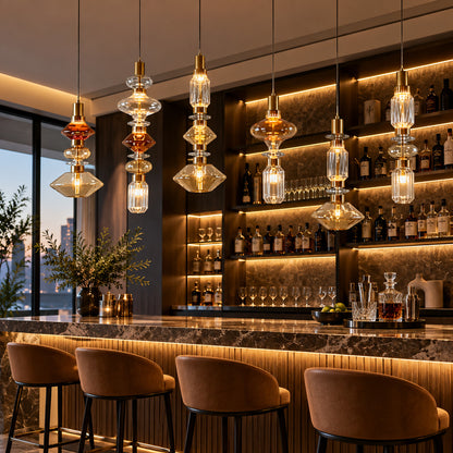 Danza glass pendant lights over a cocktail bar counter