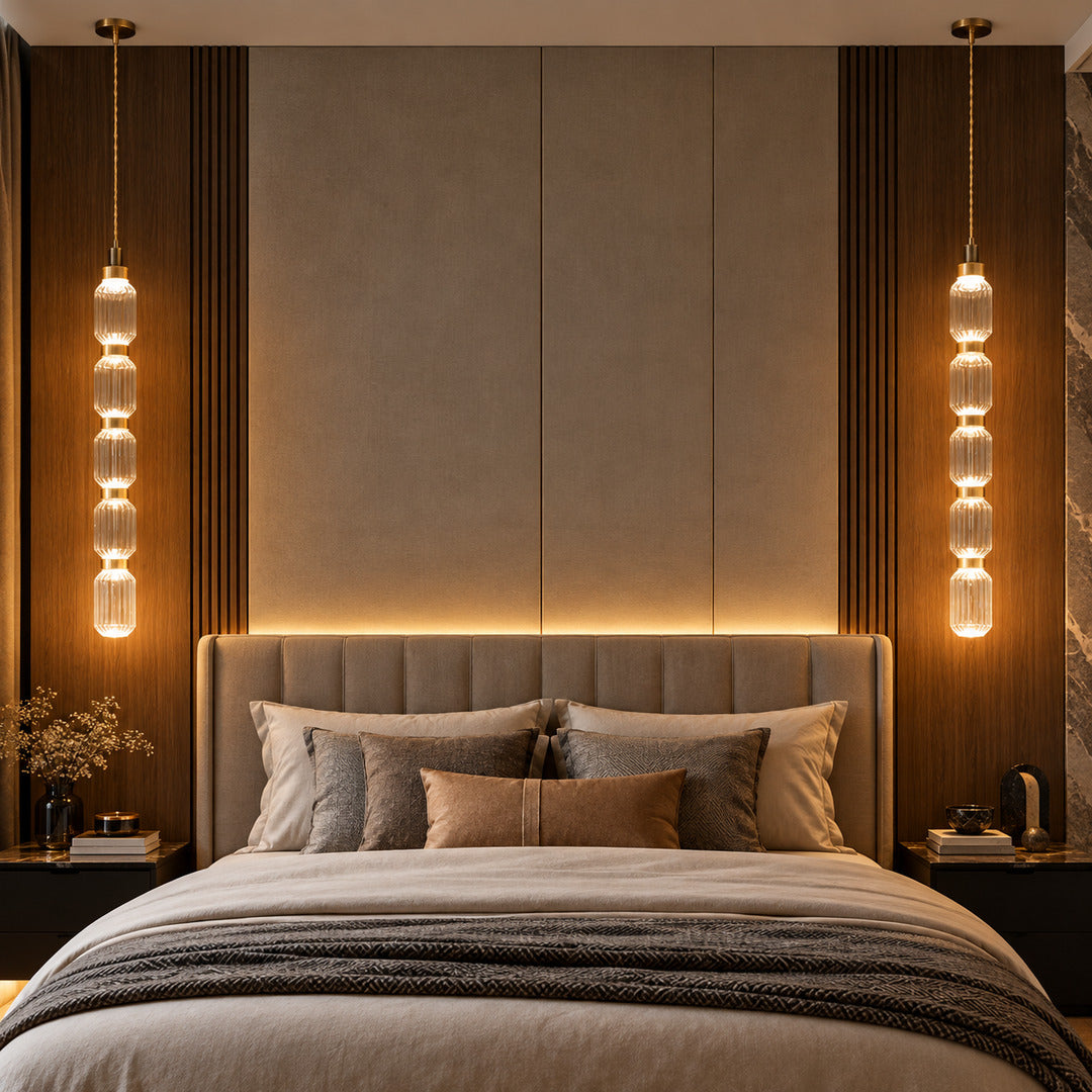 Slim Danza glass pendant light hanging beside a bed as a bedside light