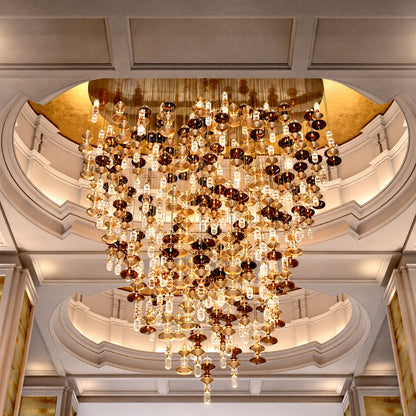 Six-head Danza glass pendant cluster as a focal point in a hotel lobby