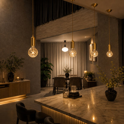 Single Diamante cut-glass pendant light over a breakfast bar counter