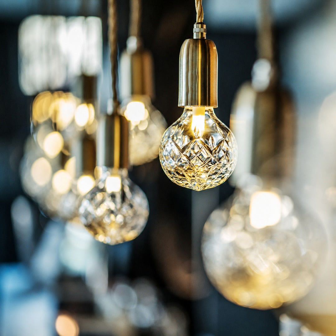 Close-up of the faceted diamond-cut glass bulb shade on the Diamante pendant light catching the light