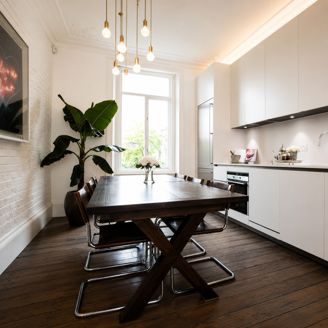 Row of Diamante cut-glass pendant lights suspended over a modern kitchen island