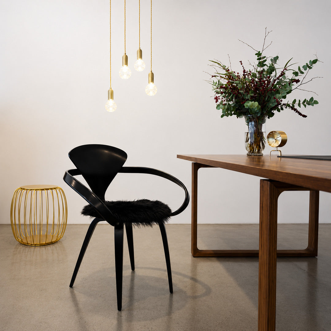 Diamante glass pendant light casting sparkling warm light over a contemporary dining table