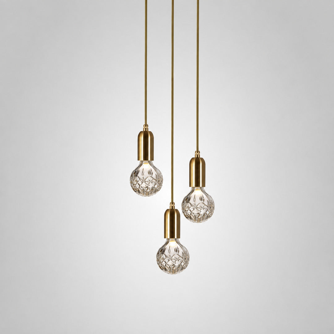 Three-head Diamante cut-glass pendant light clustered over a kitchen island